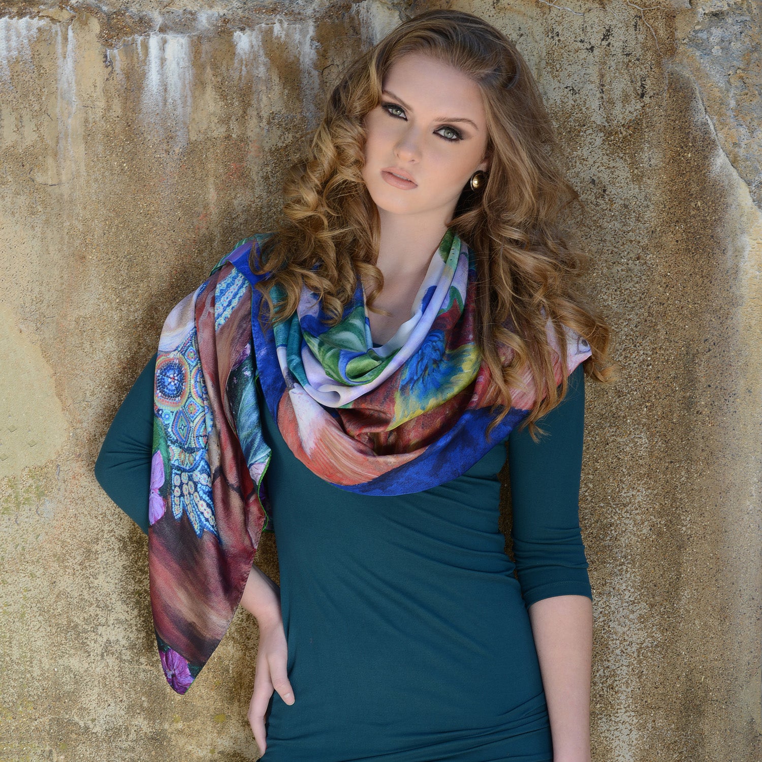 Model wearing Chetna Singh bold jewel tone bird and floral print long silk scarf. 