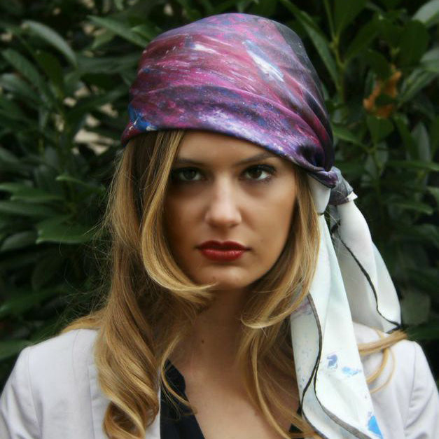 Model wearing Chetna Singh white and purple horse print square silk scarf.