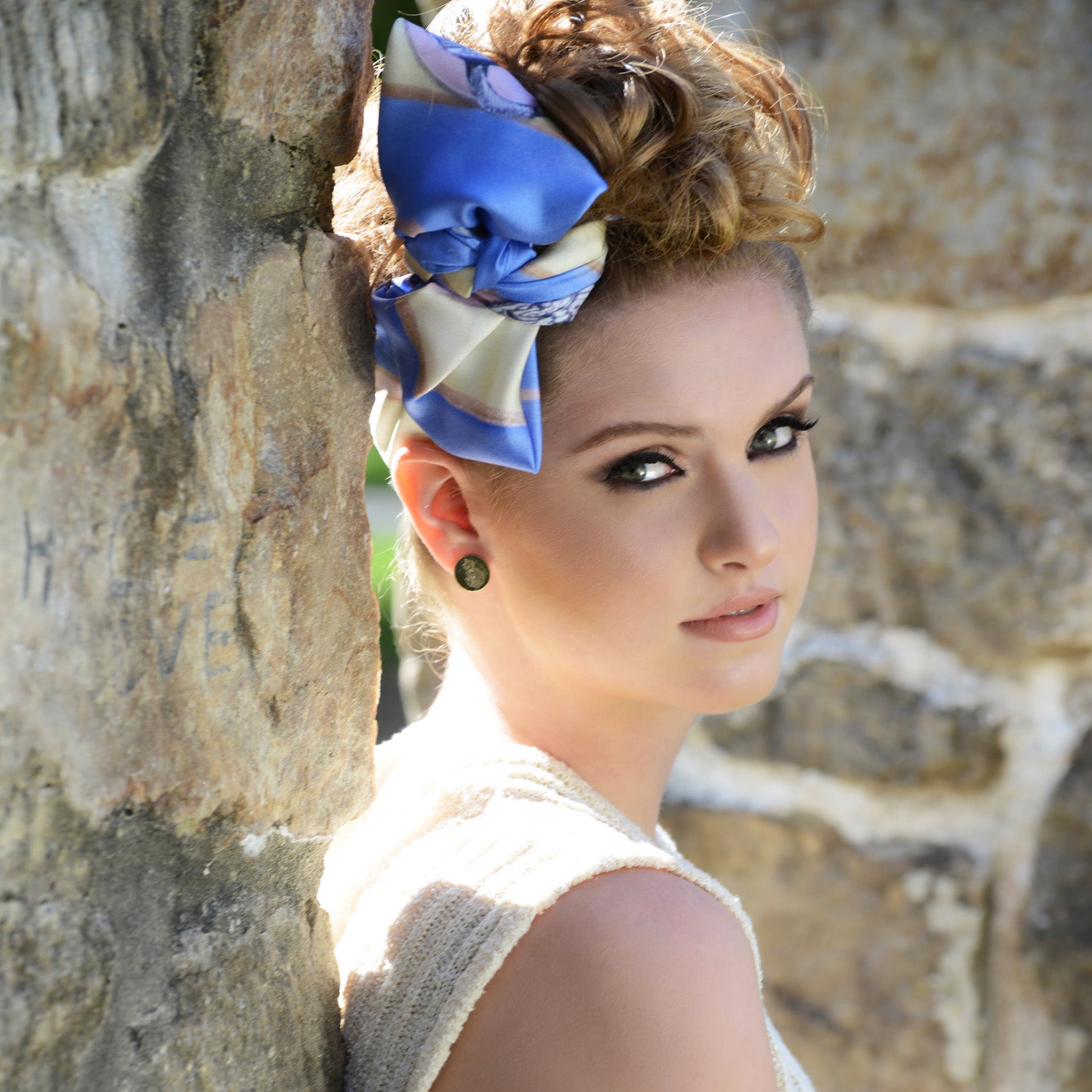 Model wearing Chetna Singh key and lock "Paris" print square silk scarf.
