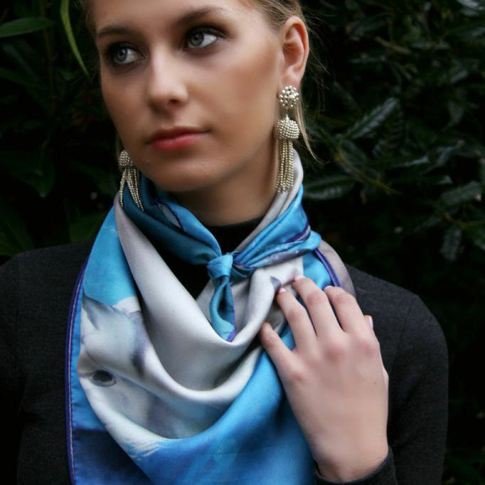 Model wearing Chetna Singh deep blue horse print square silk scarf.