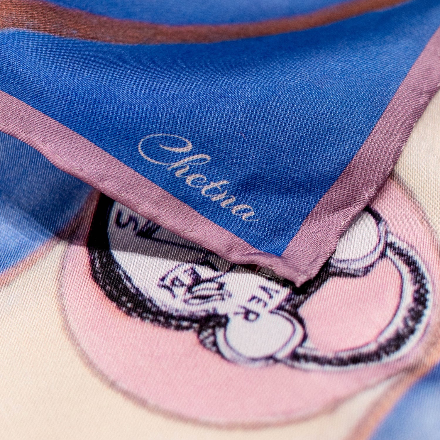 Close-up of Chetna Singh key and lock "Paris" print square silk scarf.