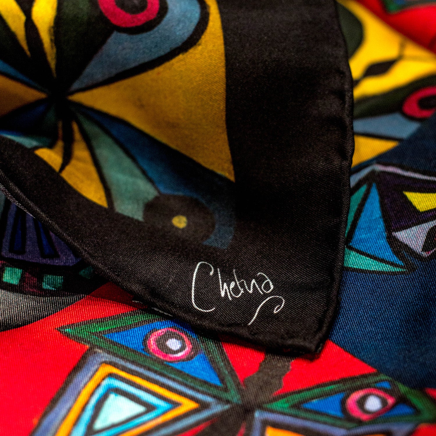 Close-up of Chetna Singh multi-color butterfly print square silk scarf.