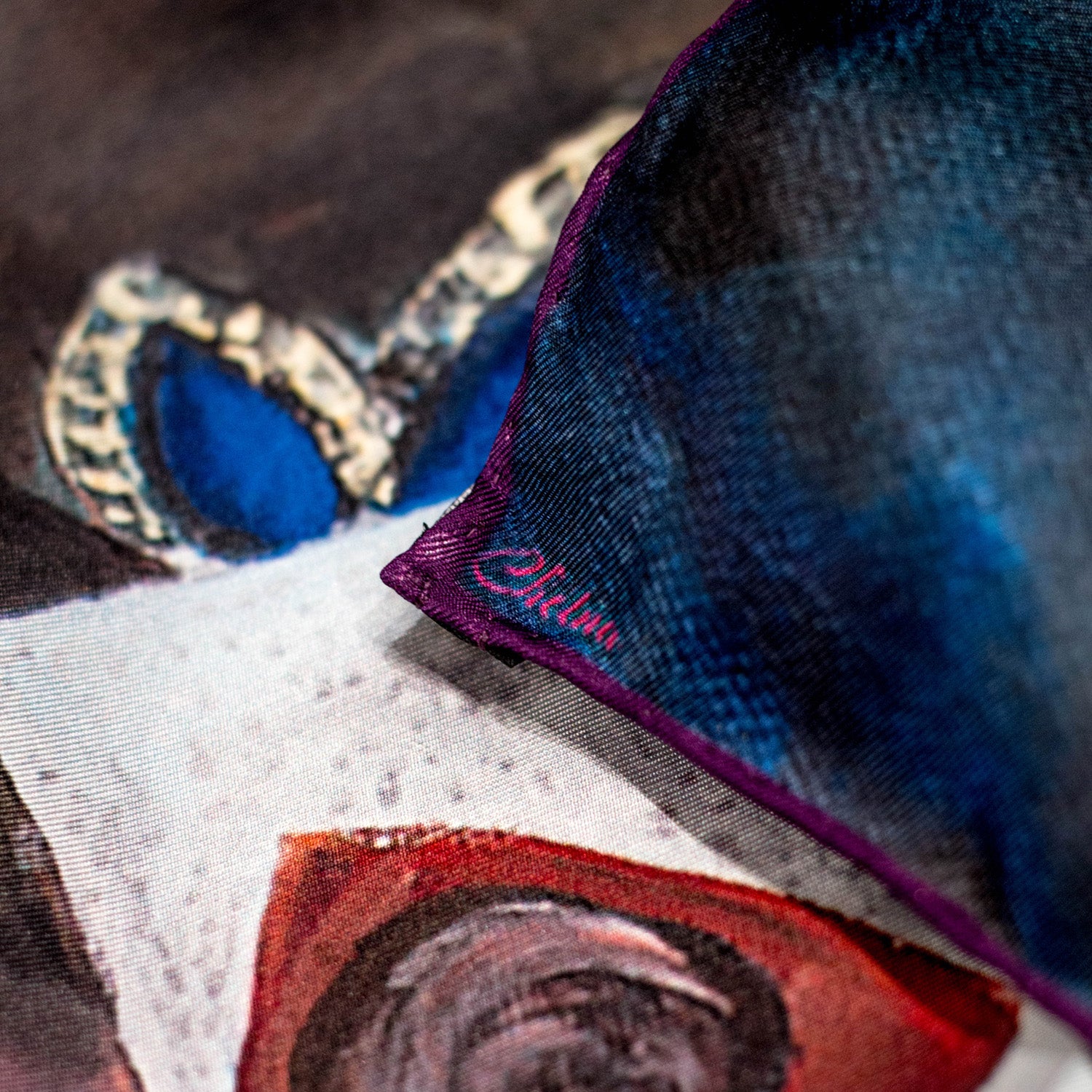 Close-up of Chetna Singh blue tone Venetian woman in mask print silk scarf.