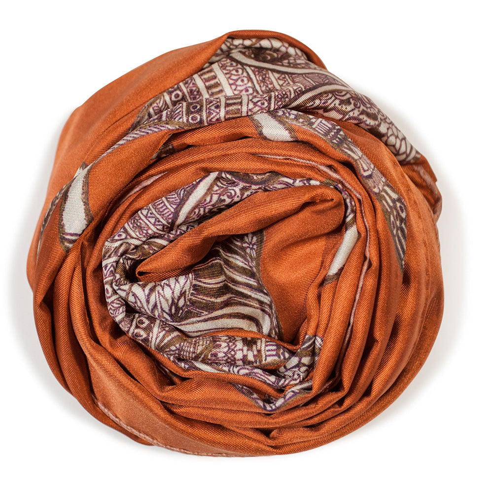 Chetna Singh orange and rust tone elephant print long silk scarf.
