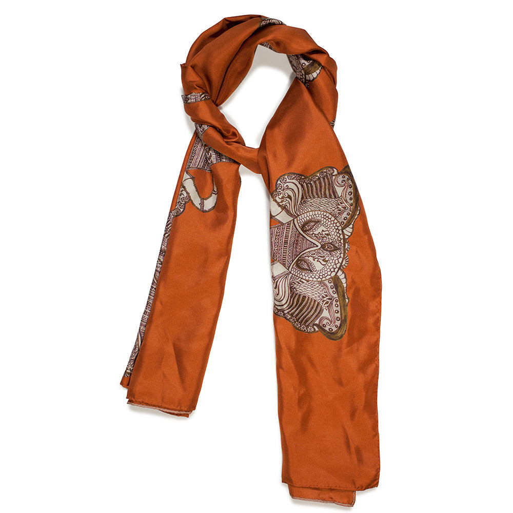 Chetna Singh orange and rust tone elephant print long silk scarf.
