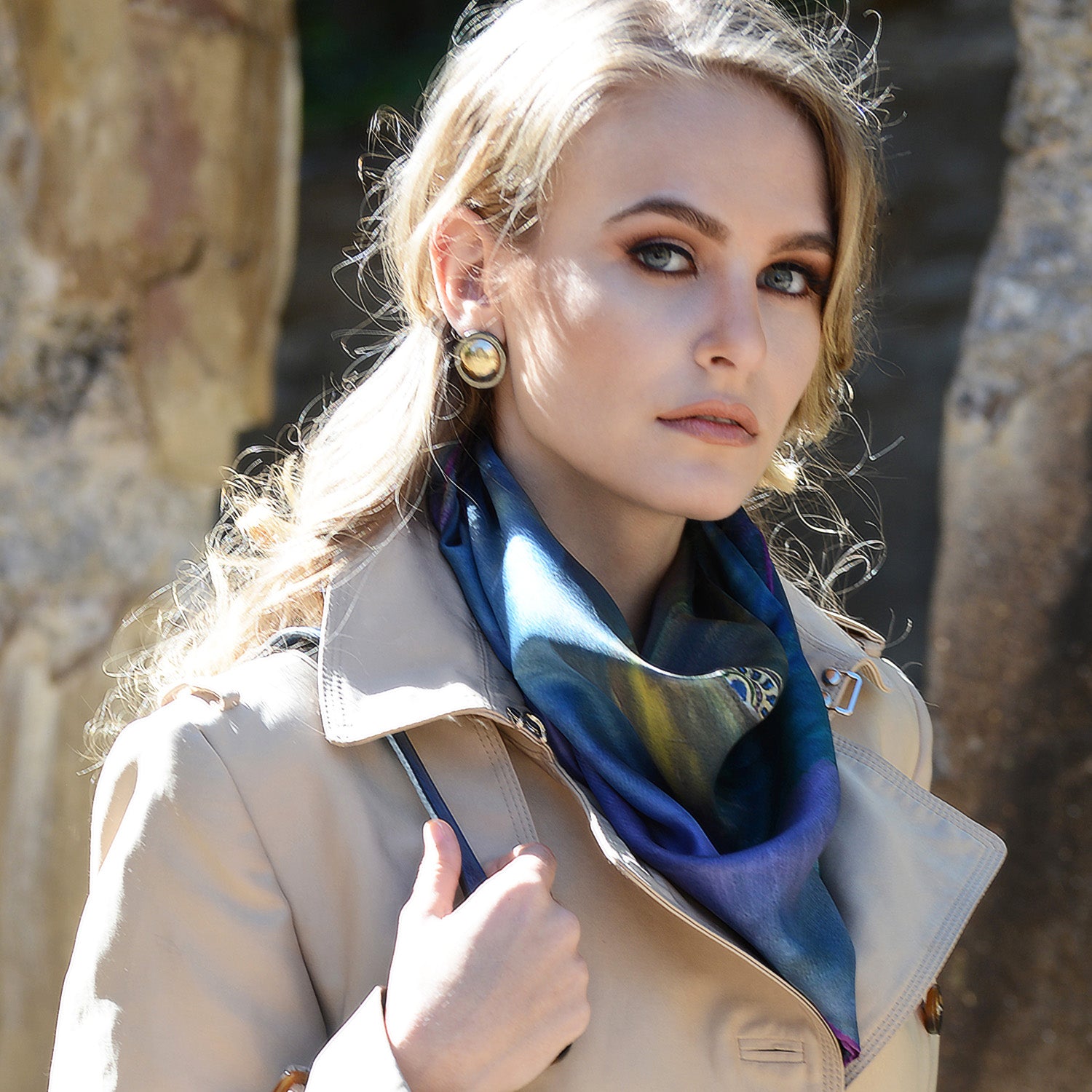 Model wearing Chetna Singh blue tone Venetian woman in mask print silk scarf. 