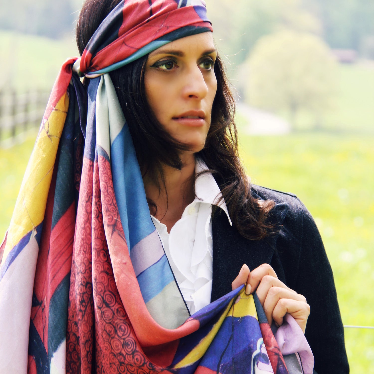 Model wearing Chetna Singh Multi Color Buddha Face Square Silk Scarf. 