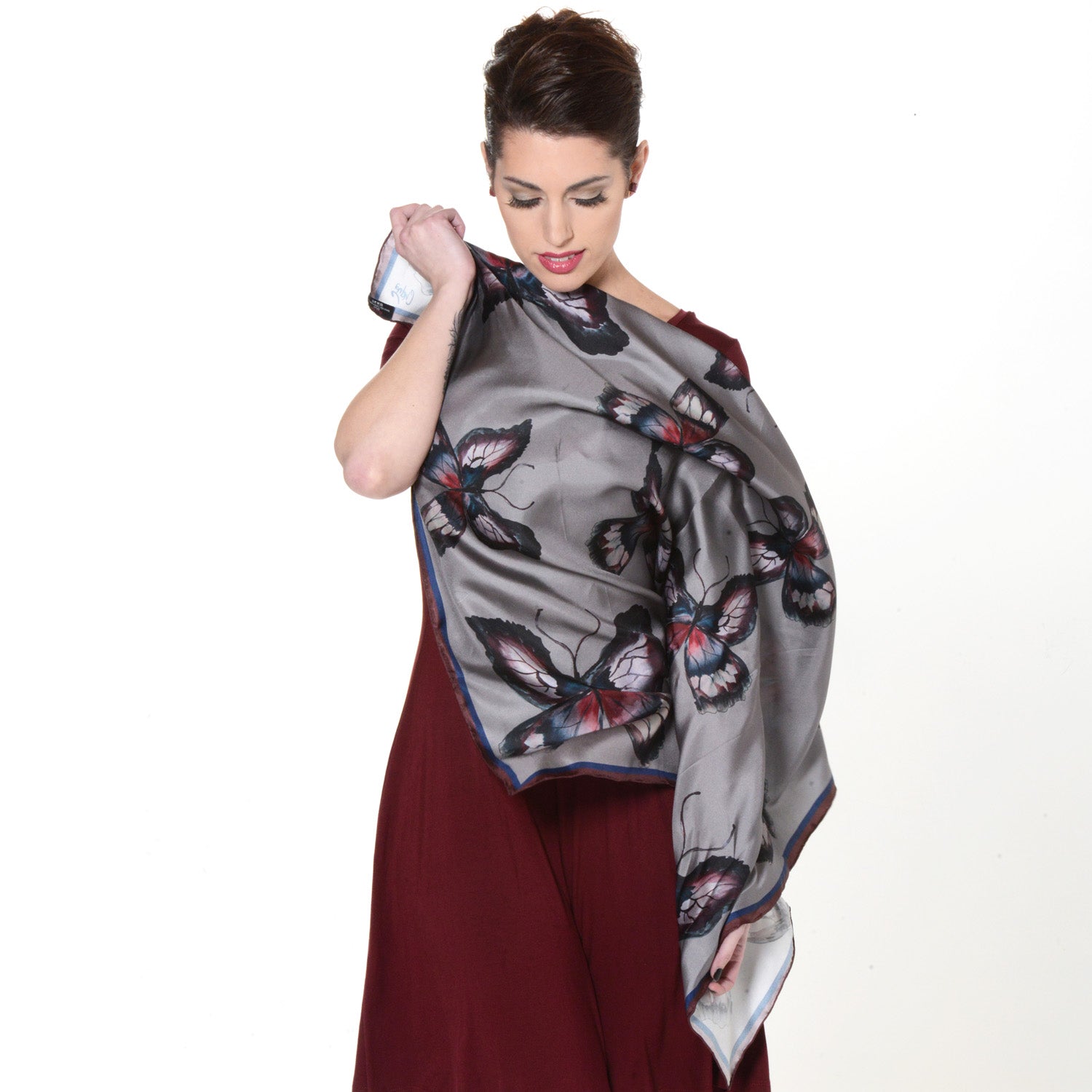 Model wearing Chetna Singh grey butterfly print square silk scarf. 