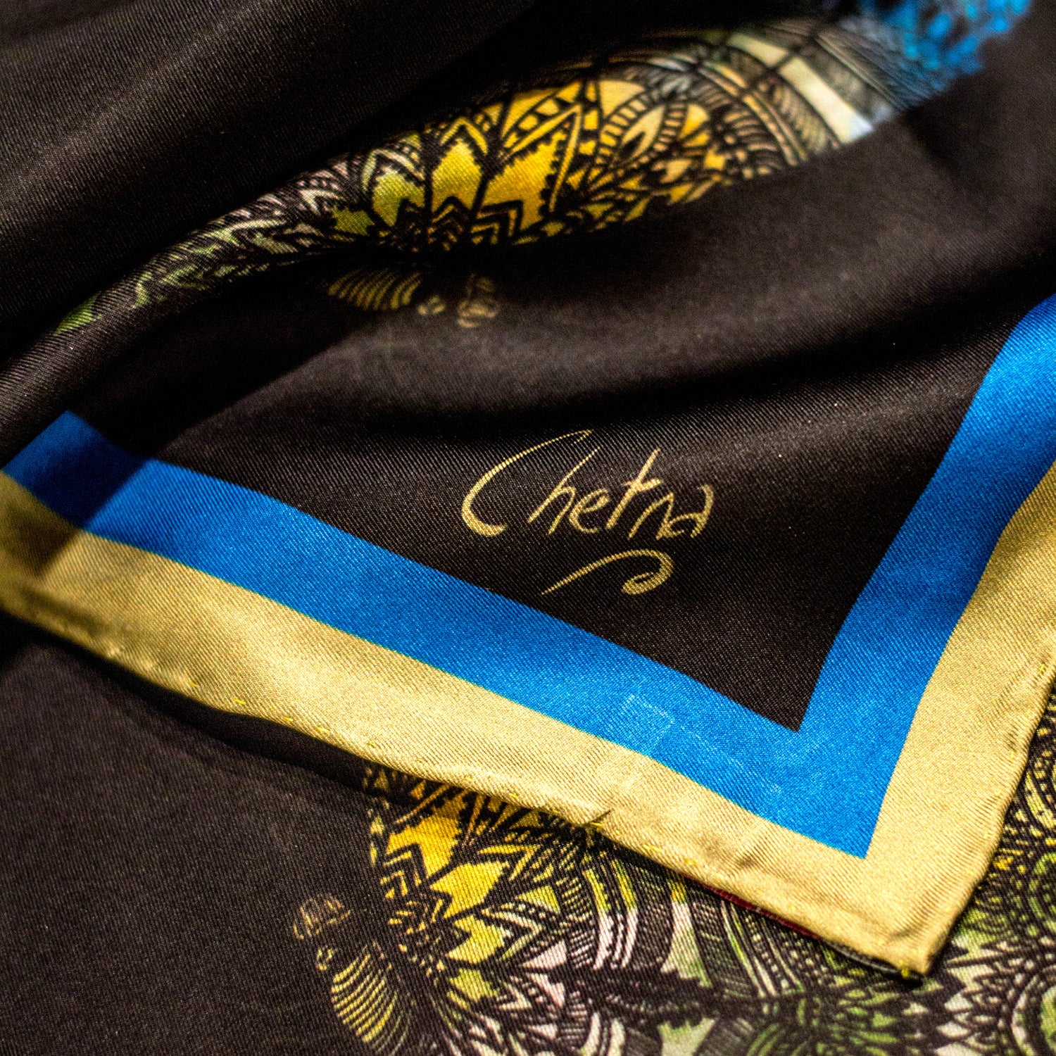 Close-up of Chetna Singh black butterfly print long silk scarf. 