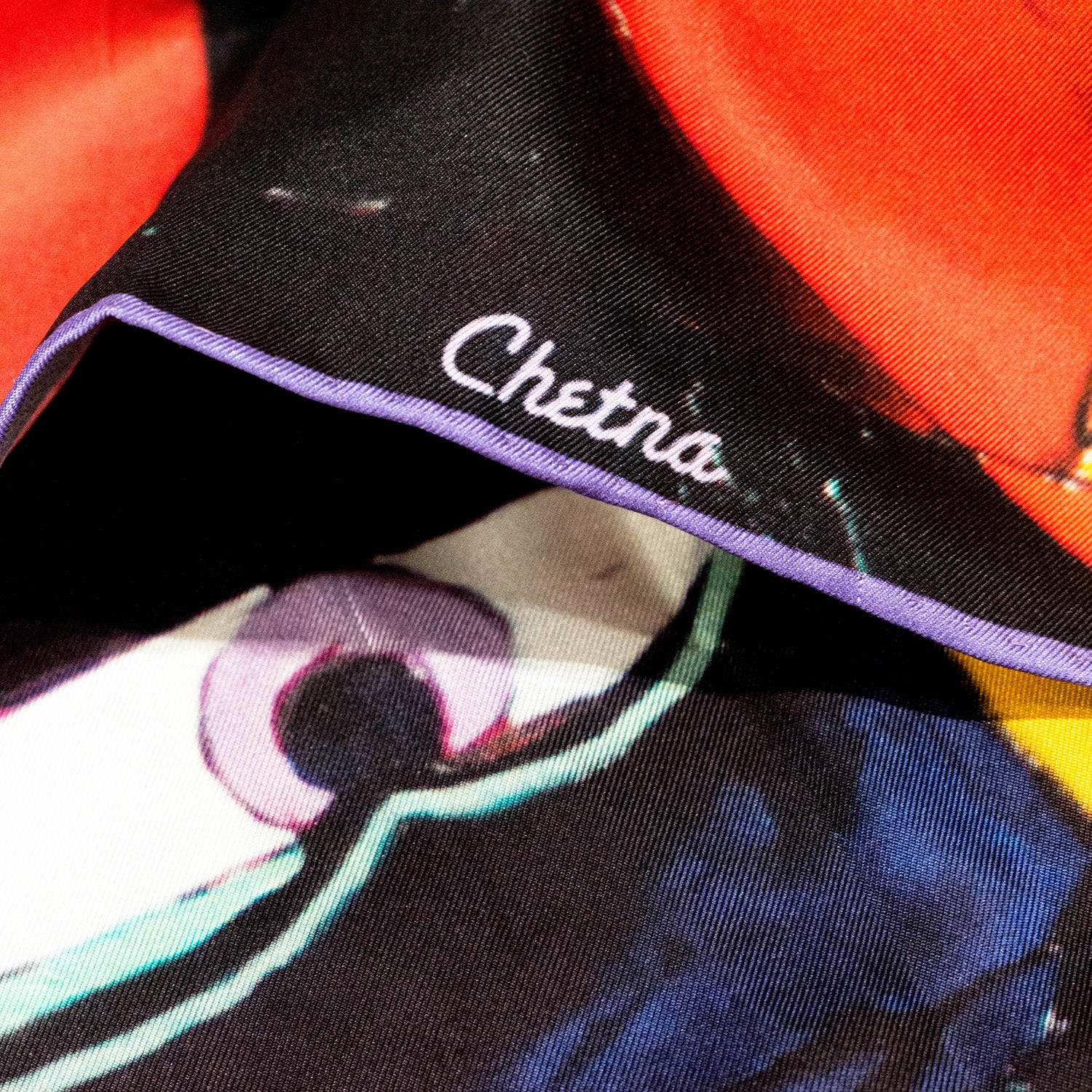 Close-up of Chetna Singh Multi Color Buddha Face Square Silk Scarf. 
