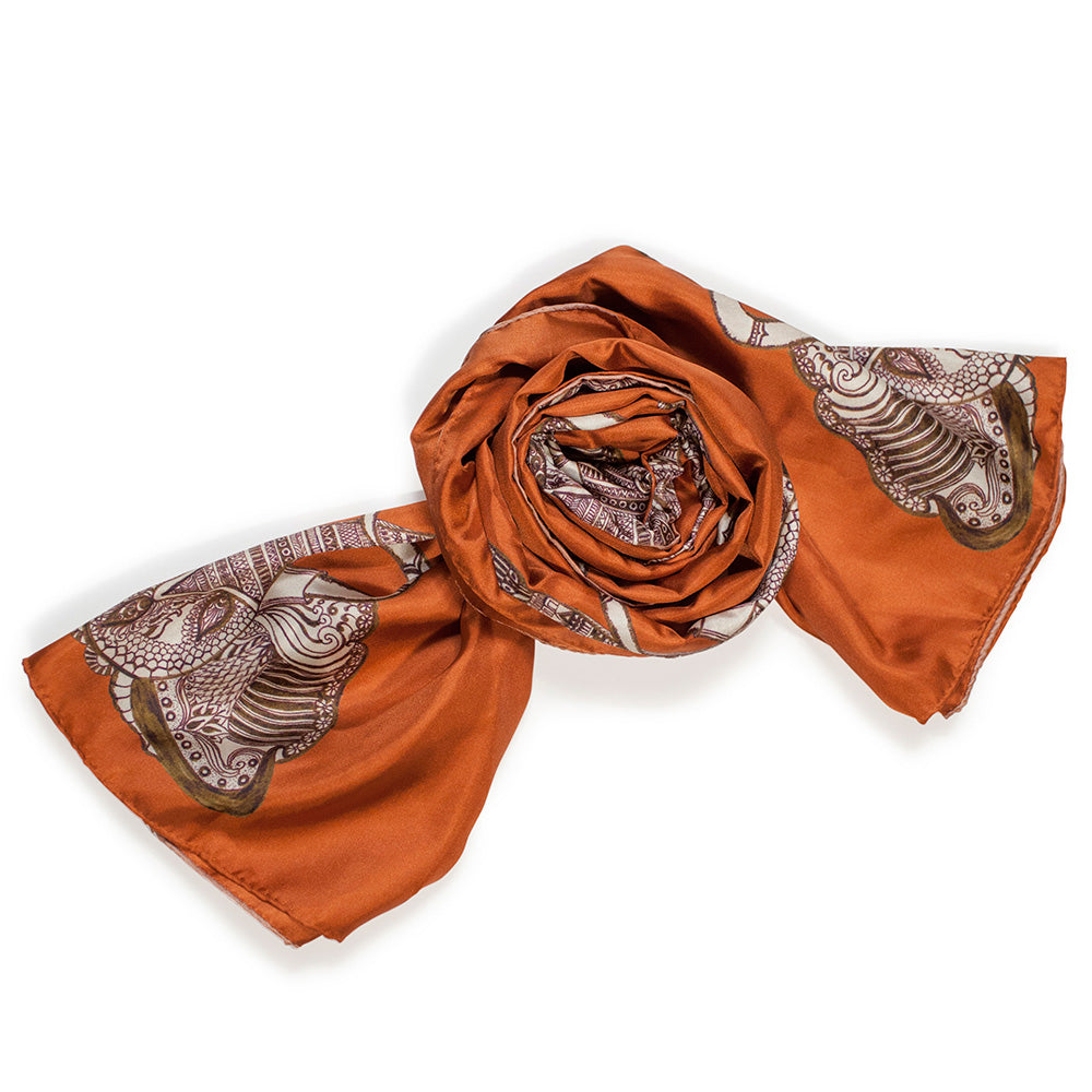 Chetna Singh orange and rust tone elephant print long silk scarf. 